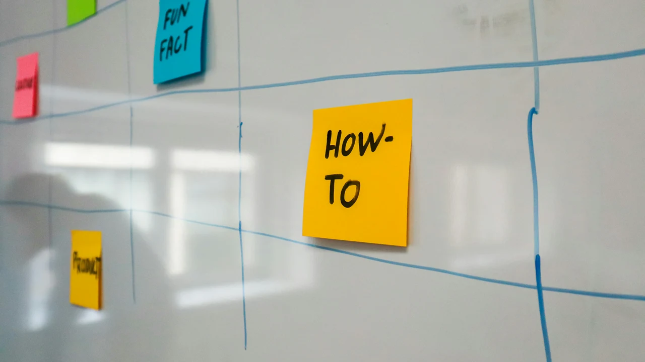 Whiteboard with sticky notes and process lines, representing structured decision mapping