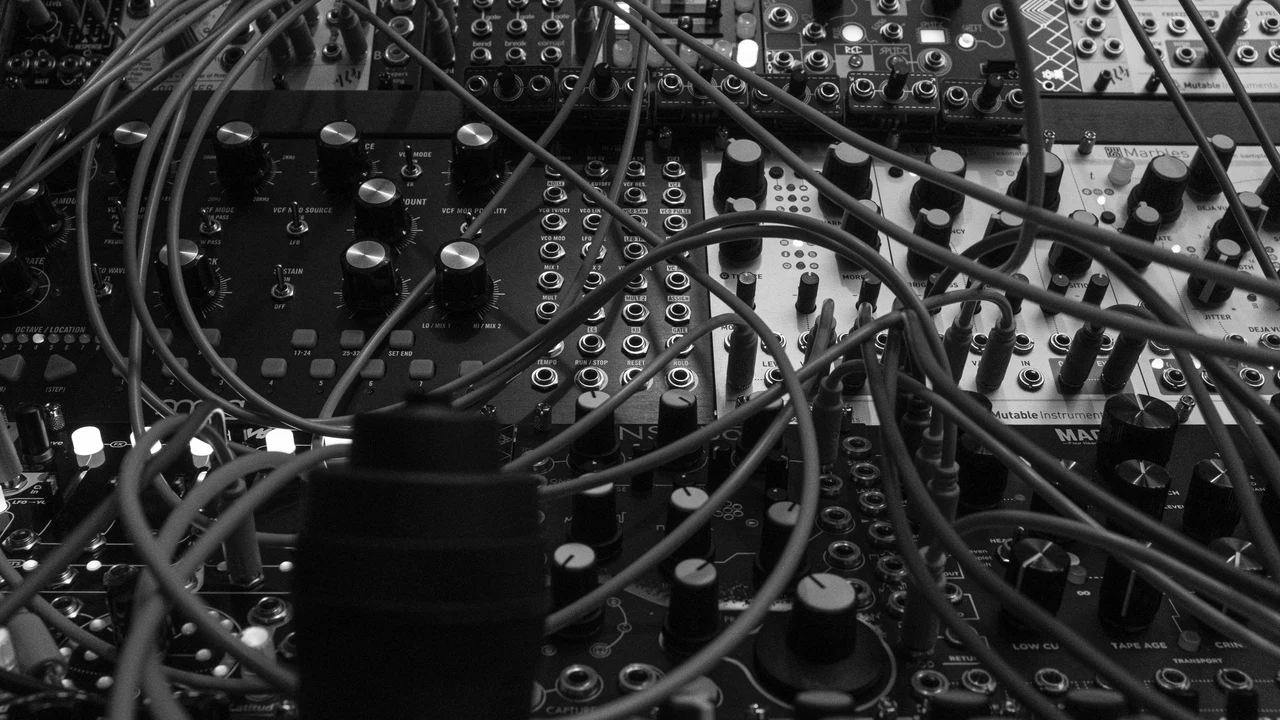 Dense tangle of cables and connectors, representing systems too complex to easily verify