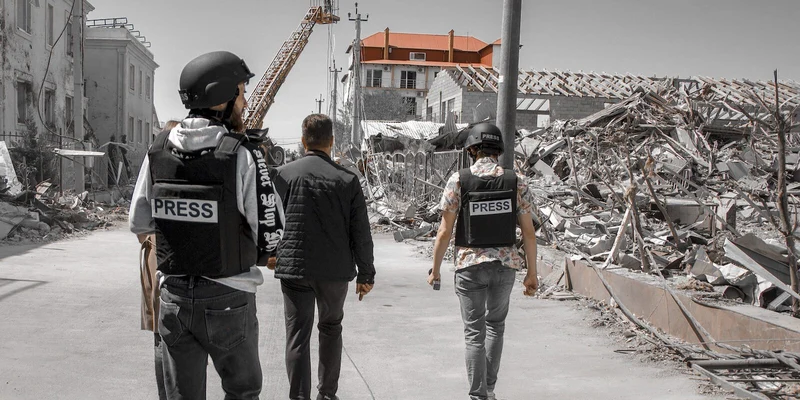 Journalists reporting in the field